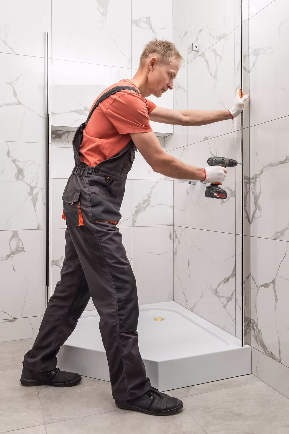 Shower screen installation London - drilling tiles and fitting brackets